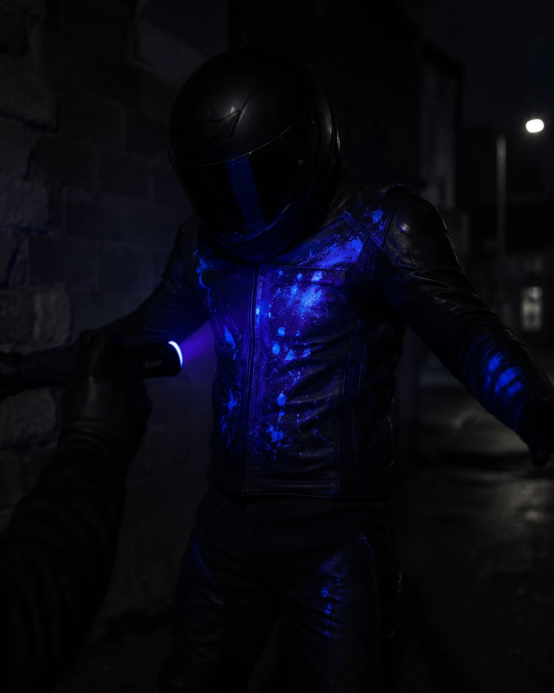 UV-reactive Safety Ink glowing on an attacker under forensic light